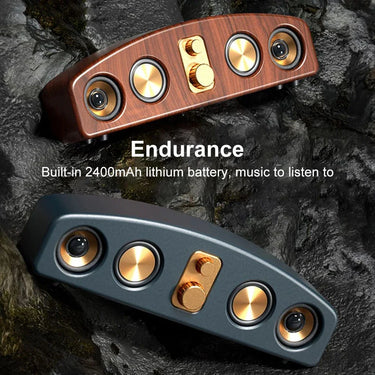 Dual wireless Bluetooth speakers with gold knobs and 2400mAh battery on rocky background