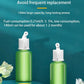 Two 140ml green aroma diffuser refills with white caps on teal display, large capacity, long-lasting scent.