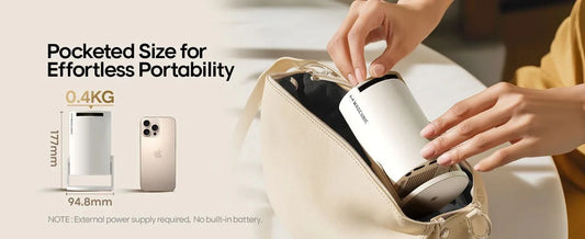 Compact portable gadget placed in a handbag beside a smartphone for size comparison