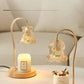 Crystal candle warmer lamps with glass shades on a modern table, warming scented candles