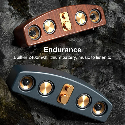 Dual wireless Bluetooth speakers with gold knobs and 2400mAh battery on rocky background
