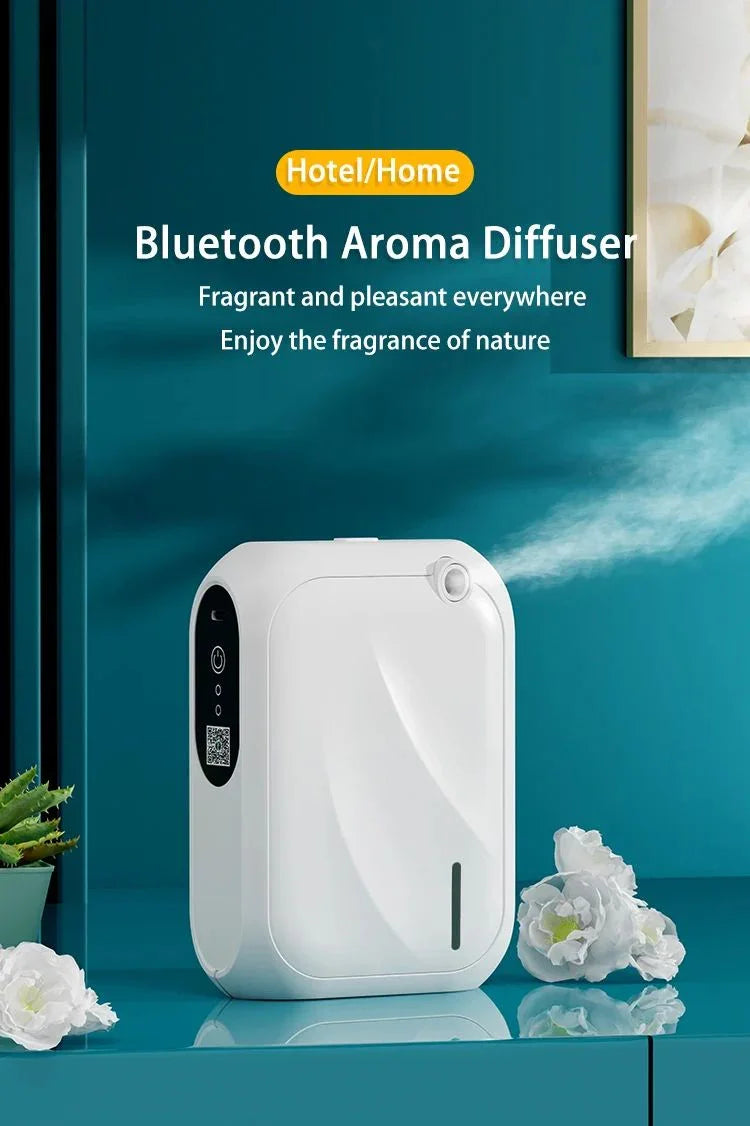 White Bluetooth aroma diffuser emitting mist on teal surface, surrounded by white flowers, modern home decor