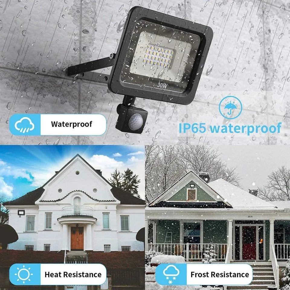 Outdoor LED floodlight with motion sensor, IP65 waterproof, heat and frost resistant, shown in rain and snow conditions.