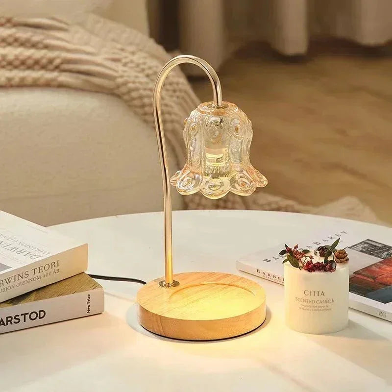 Modern glass flower-shaped table lamp with wooden base on cozy living room table