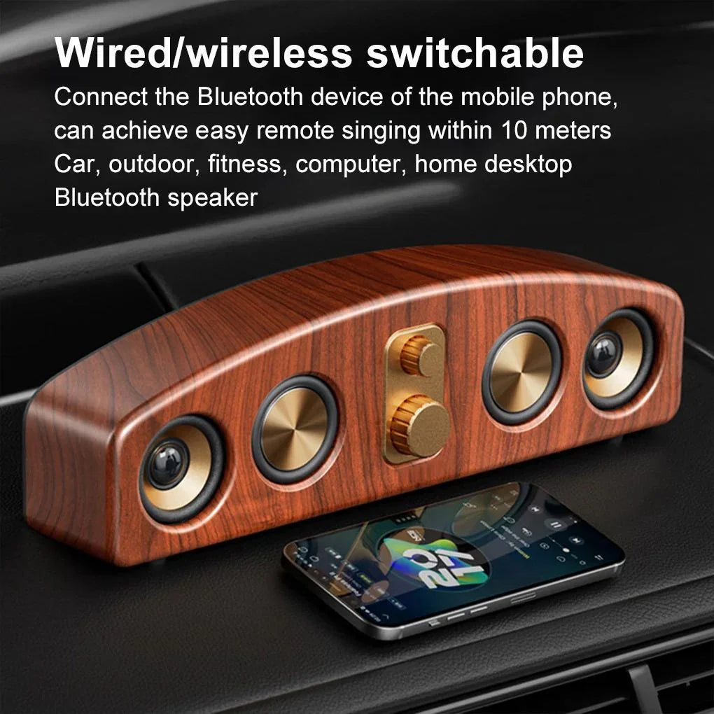Wooden Bluetooth speaker with gold knobs, wireless connectivity, and smartphone on black surface