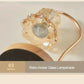 Close-up of retro amber glass lampshade with gold curved arm, modern home decor accent