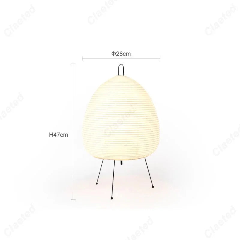 Modern table lamp with white paper shade and tripod legs, 47cm tall, 28cm wide