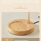 Close-up of a modern lamp with a round premium wood base and gold metal stem, smart home decor.