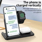 3-in-1 wireless charging station with smartphone, smartwatch, and earbuds on a desk